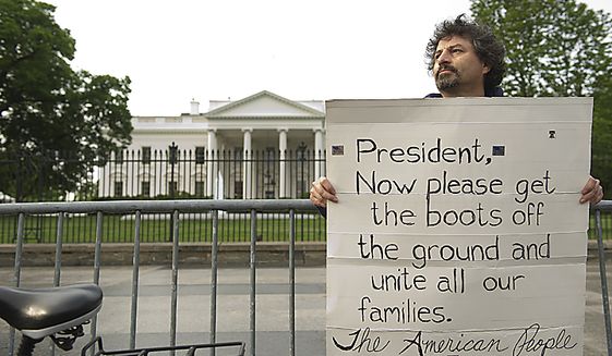 Danny Montoya of Warrenton, Va., holds a sign up in Lafayette Park outside the White House on May 2, 2011, the morning after the country learned that Osama Bin Laden had been killed by U.S. Navy Seals. Montoya says that our first initiative following the Sept. 11 attacks was to get Osama Bin Laden, and he feels that now that he&#39;s dead, some of the U.S. troops who have been assigned to more remote areas of Afghanistan and Pakistan should be able to come home. (Barbara L. Salisbury/The Washington Times)