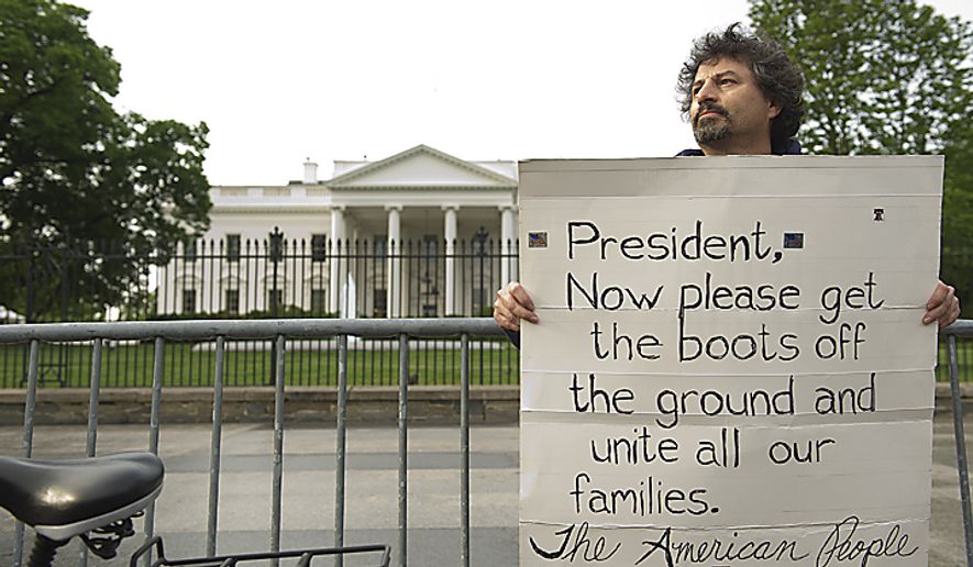 Danny Montoya of Warrenton, Va., holds a sign up in Lafayette Park outside the White House on May 2, 2011, the morning after the country learned that Osama Bin Laden had been killed by U.S. Navy Seals. Montoya says that our first initiative following the Sept. 11 attacks was to get Osama Bin Laden, and he feels that now that he&#39;s dead, some of the U.S. troops who have been assigned to more remote areas of Afghanistan and Pakistan should be able to come home. (Barbara L. Salisbury/The Washington Times)