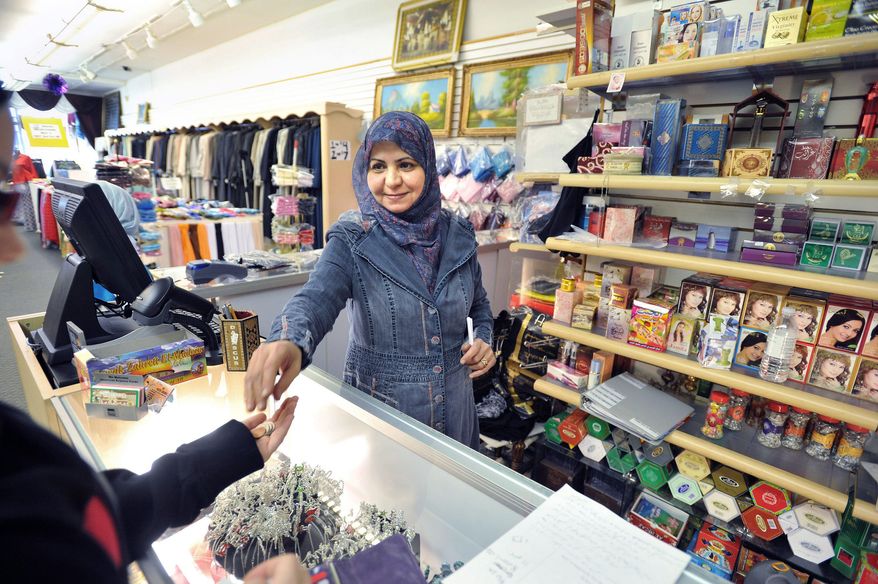 PHOTOGRAPHS BY BRYAN MITCHELL/SPECIAL TO THE WASHINGTON TIMES
"Everybody's happy" Osama bin Laden is dead, says Ilham Hussein, working at the Mekkah Islamic Superstore in Dearborn, Mich. "He's given the Muslim people a bad name." The sentiment is common in Dearborn, with the highest concentration of Arabs in North America.