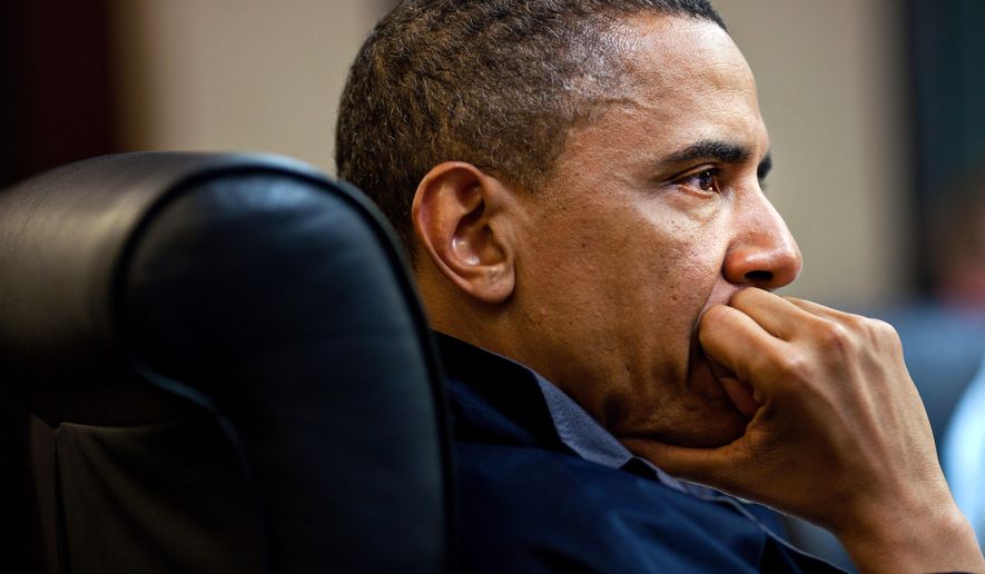 In this image released by the White House, President Obama listens during one in a series of meetings discussing the mission against Osama bin Laden, in the Situation Room of the White House on Sunday. (Associated Press)