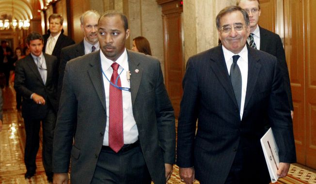 CIA Director Leon E. Panetta (right) leaves Capitol Hill in Washington on Tuesday, May 3, 2011, after briefing members of Congress on the raid on Osama bin Laden&#x27;s compound in Pakistan. (AP Photo/Alex Brandon)
