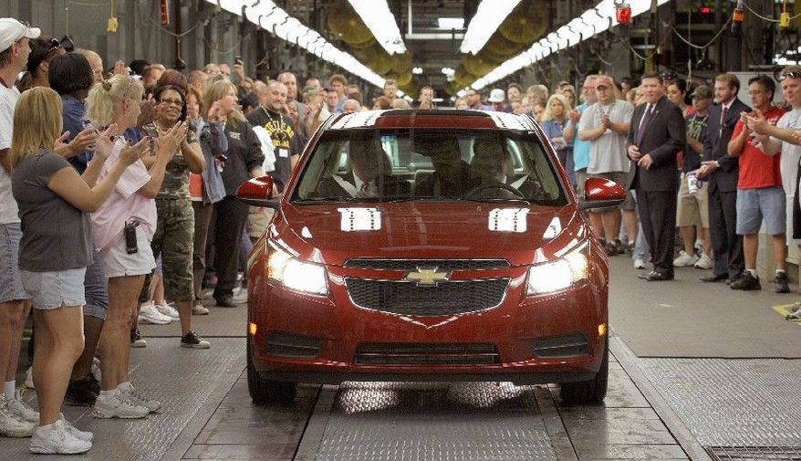 Associated Press
General Motors workers cheer as the first Chevrolet Cruze compact sedan rolls off the assembly line Sept. 8 at the GM factory in Lordstown, Ohio. Chevrolet said it sold 150,652 Cruze sedans during the first quarter of 2011.