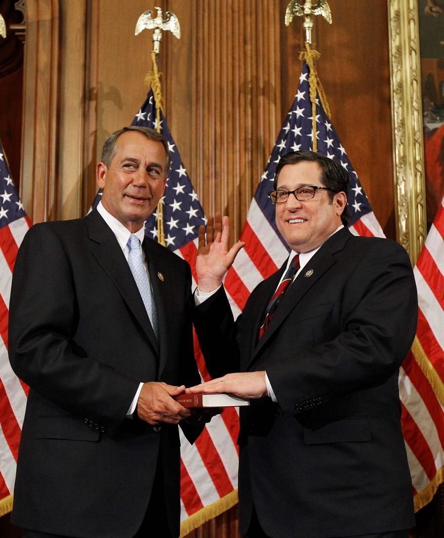 House Speaker John Boehner of Ohio, left, participates in a ceremonial House swearing-in ceremony for Rep. Steve Rothman, D-N.J., on Capitol Hill in Washington Wednesday, Jan. 5, 2011.(AP Photo/Alex Brandon)