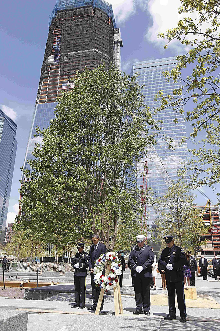 President Barack Obama pauses after laying a wreath at the National Sept. 11 Memorial at Ground Zero in New York, Thursday, May 5, 2011. (AP Photo/Charles Dharapak)