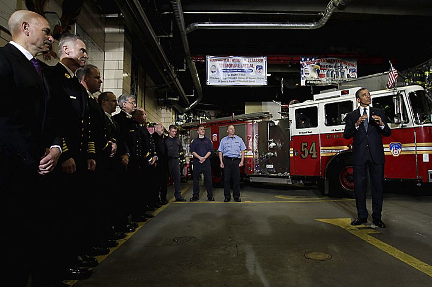 U.S. President Barack Obama speaks to firefighters at the headquarters of Engine Company 54, Ladder Company 4 and Battalion 9, in New York, U.S., on Thursday, May 5, 2011. The firehouse lost 15 members, the single largest loss of life of any firehouse among the 343 firefighters who died during the attack on the World Trade Center on Sept. 11, 2001. Obama will go to New York's "Ground Zero" today, seeking to provide some closure to the worst terrorist attack on U.S. soil now that the world's most hunted terrorist, al-Qaeda leader Osama bin Laden, won't be "walking on this earth again." Photographer: John Angelillo/Pool via Bloomberg