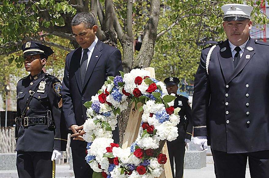 President Barack Obama pauses after laying a wreath at the National Sept. 11 Memorial at Ground Zero in New York, Thursday, May 5, 2011. (AP Photo/Charles Dharapak)