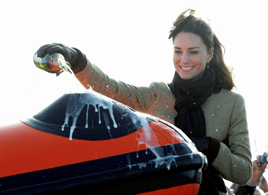 There's more of this ahead for the new duchess of Cambridge (left), when as Kate Middletown, fiancee of Britain's Prince William, she poured champagne over a lifeboat commissioned into service in February. Princess Maxima of the Netherlands (center at right with her husband, Crown Prince Willem Alexander in the jacket behind her) was a commoner from Argentina when she married into the royal household. She has brought a commoner's touch to her royal duties and is popular with the people.