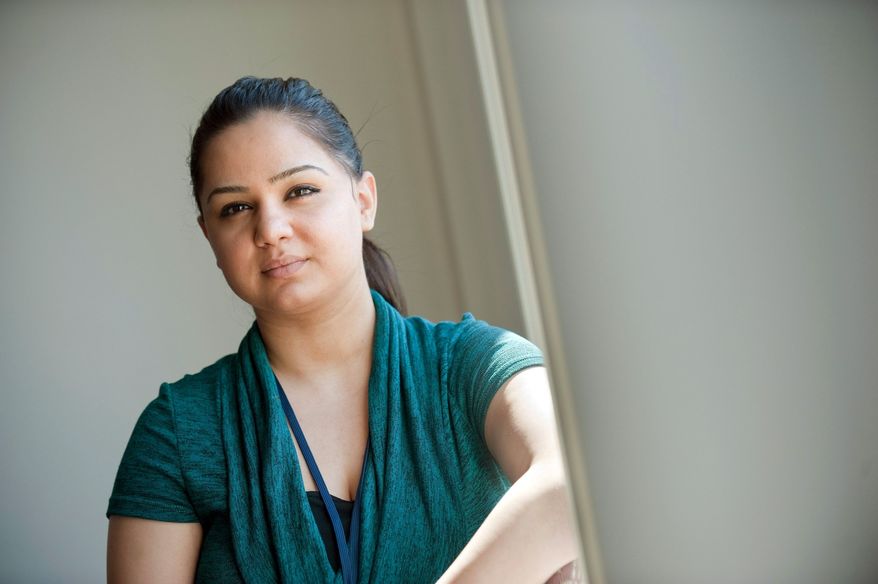 BRYAN MITCHELL/SPECIAL TO THE WASHINGTON TIMES
Noora Yousif, 24, an Arab-American and a Christian, works as a receptionist in Detroit. She came to the U.S. from Iraq 10 years ago and lives in Sterling Heights. She's a Chaldean, an Iraqi Catholic. "I don't think a lot of people know what Chaldeans are," she said.