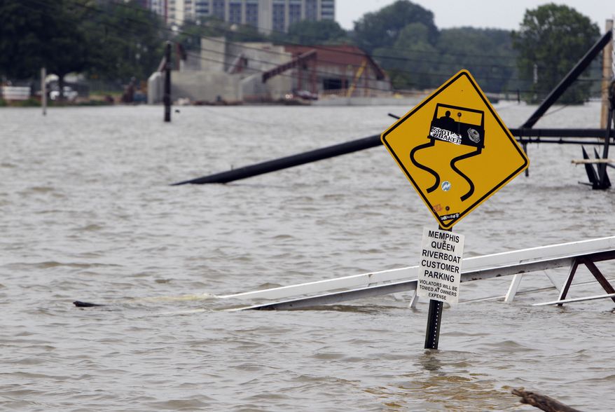 A ramp leading to the Memphis Queen riverboat and its parking area are surrounded by floodwater on Saturday, May 7, 2011, in Memphis, Tenn. Communities all along the banks of the Mississippi are keeping a close eye on the river's rise with the crest in Memphis not expected until Tuesday. (AP Photo/Jeff Roberson)
