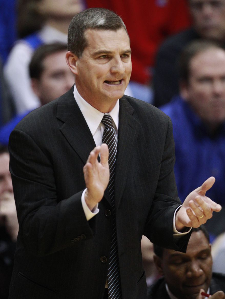 FILE - In this March 2, 2011, file photo, Texas A&amp;M coach Mark Turgeon urges on his team during an NCAA college basketball game against Kansas in Lawrence, Kan. Turgeon has agreed to take over at Maryland, calling it a &quot;great opportunity.&quot; Turgeon went 97-40 in four seasons with the Aggies, leading them to four consecutive appearances in the NCAA tournament. They went 24-9 this past season, losing to Florida State in the second round. (AP Photo/Orlin Wagner, File)
