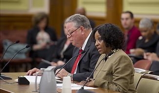 Lorraine A. Green, chairman of Mayor Vincent C. Gray&#39;s campaign and head of his transition team, testifies at a hearing at the Wilson Building in Washington, D.C., on Friday, May 13, 2011 to discuss the hiring practices within the Gray administration. Next to Ms. Green is her attorney, Thomas C. Green. (Barbara L. Salisbury/The Washington Times)