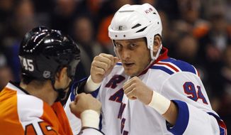 FILE - In this Nov. 4, 2010, file photo, Philadelphia Flyers&#39; Jody Shelley, left, and New York Rangers&#39; Derek Boogaard fight during an NHL hockey game in Philadelphia. Boogaard, at age 28, died on Friday. Boogaard signed with the Rangers as a free agent in July,2010 appearing in 22 games last season, registering one goal and one assist. (AP Photo/Matt Slocum, File)