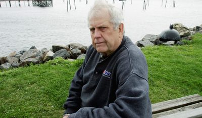 Steve Waterman, author and former Navy underwater photographer, is one of an elite few who track down people who falsely claim they are U.S. Navy SEALS. (Associated Press