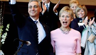 Rahm Emanuel and his wife, Amy Rule, acknowledge the crowd Monday before Mr. Emanuel &#39;s swearing in as Chicago&#39;s mayor, succeeding Richard M. Daley. (Associated Press)