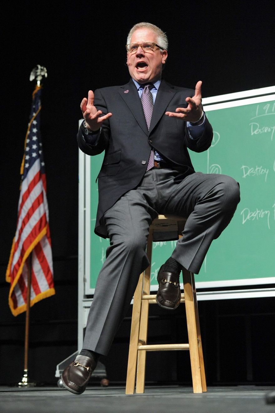 Political commentator Glenn Beck appears on stage in Anchorage, Alaska Saturday, Sept. 11, 2010. The event featuring the former Alaska Gov. and the conservative commentator Saturday night brought out two very different crowds. (AP Photo/Michael Dinneen)
