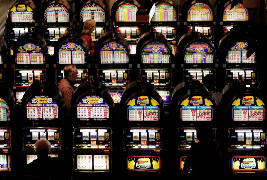 THE WASHINGTON TIMES
Rows of slot machines line the casino floor at Charles Town Races in West Virginia. Some see a direct connection between the state's approval of slot machines in 1994 and the rejuvenation of the state's breeding industry.