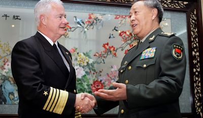 Adm. Timothy Keating, U.S. commander in the Asia-Pacific region, shakes hands with Chinese Gen. Chen Bingde upon arrival at the Ba Yi Building in Beijing in 2008. Gen. Chen, the military chief of staff, arrived in Washington on Monday for the first high-level military exchange since Beijing cut off military ties early last year to protest U.S. arms sales to Taiwan. (Associated Press)