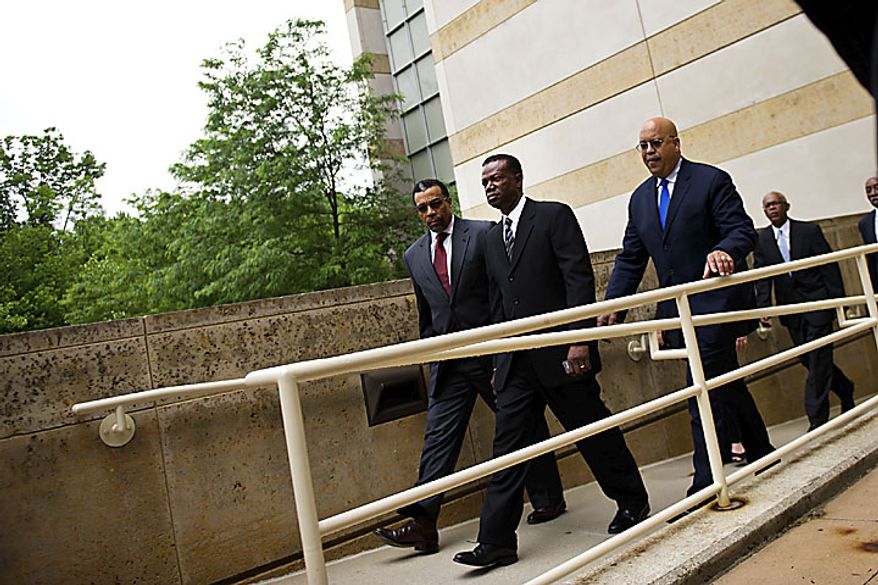 Former Prince George's County Executive Jack B. Johnson arrives at the U.S. Federal Courthouse in, in Greenbelt, Md., Tuesday, May 17, 2011. At left is his lawyer Billy Martin. (Drew Angerer/The Washington Times)