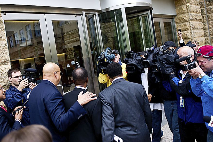 The media surrounds former Prince George's County Executive Jack B. Johnson as he arrives at the U.S. Federal Courthouse in, in Greenbelt, Md., Tuesday, May 17, 2011. (Drew Angerer/The Washington Times)