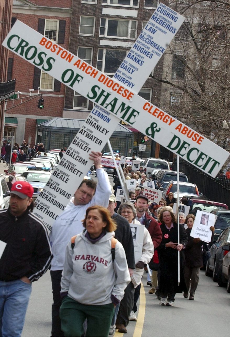** FILE ** Approximately 100 sex-abuse victims and their supporters march on Sunday, Feb. 29, 2004, in Boston from the Cathedral of the Holy Cross to the Massachusetts Statehouse to urge Gov. Mitt Romney to appoint a clergy-abuse task force to oversee the church in Massachusetts. (AP Photo/Chitose Suzuki)