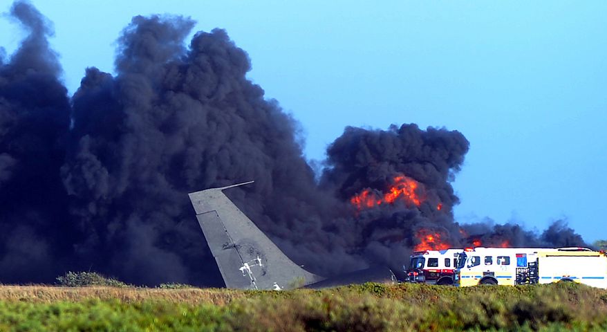 A Boeing 707 tanker burns after crashing during takeoff from Naval Base Ventura County Point Mugu in Ventura, Calif., on Wednesday, May 18, 2011. The three crewmen on board escaped with minor injuries, authorities said. (AP Photo/Ventura County Star, Stephen Osman)