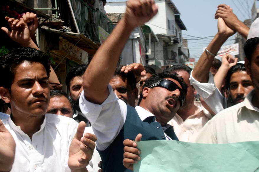 Pakistani students chant anti-U.S. slogans during a rally on Wednesday, May 18, 2011, in Abbottabad, Pakistan, to condemn the killing of al Qaeda leader Osama bin Laden and American&#39;s drone attacks on Pakistani tribal areas where militants are hiding. (AP Photo/Aqeel Ahmed)