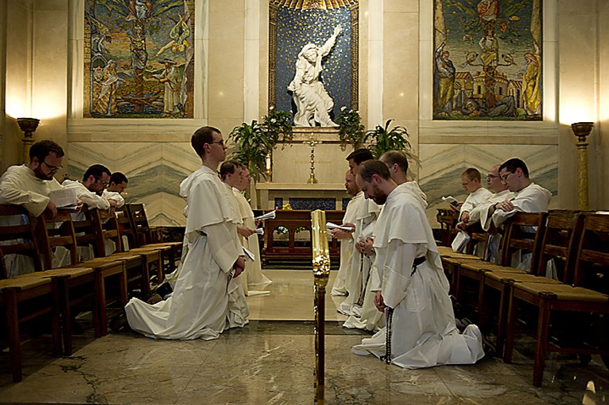 Catholic friars from the Dominican order hold a brief prayer service in a side chapel at the Cathedral of St. Matthew the Apostle in downtown Washington on Tuesday, May 24, 2011. They stopped at St. Matthew's as part of their pilgrimage from the Dominican House of Studies in Northeast Washington to St. Dominic's Parish in Southwest. This is the first time the friars have held the pilgrimage, which commemorated the date that St. Dominic's body was moved from its original grave to its current resting place in Bologna, Italy. (Barbara L. Salisbury/The Washington Times)