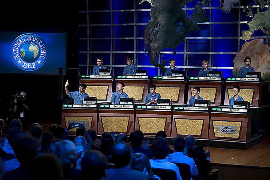 Nilai Sarda, 11, bottom left, from Atlanta, Ga., waves as he and the other 10 finalists in the 2011 National Geographic Bee take their places on stage at the National Geographic Society in Washington, D.C., on Wednesday, May 25, 2011 to begin the competition. The finalists all ranged in age from 10 to 13. Nilai came in second place. (Barbara L. Salisbury/The Washington Times)
