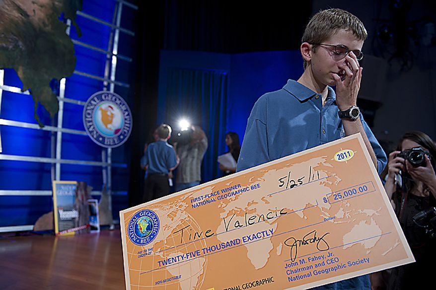 Tine Vallencic, 13, from Colleyville, Texas, has a brief quiet moment on stage in between reporter and television interviews at the National Geographic Society in Washington, D.C., after winning the 2011 National Geographic Bee on Wednesday, May 25, 2011. Tine was very emotional about the win. He was the only contestant in the final round who didn't get a single question wrong. At 13 he has already taken the ACT college entrance exam and scored a 32 out of 36, but says he still has five years to figure out where he wants to go to college and what he wants to study. (Barbara L. Salisbury/The Washington Times)