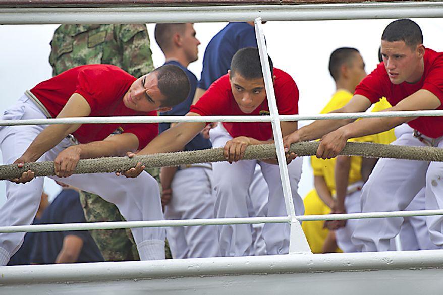 Crew members pull a rope to help anchor the ship as the ARC "Gloria" docks on the waterfront in Alexandria, Va., on May 24, 2011. The ARC "Gloria" is Colombia's flagship and the training ship of the Colombian Navy. (Drew Angerer/The Washington Times)