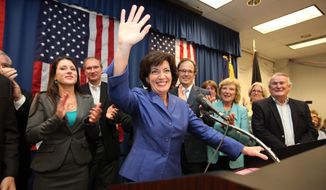 ** FILE ** Erie County Clerk Kathleen C. Hochul waves to the crowd at a union hall in Williamsville, N.Y., on Tuesday, May 24, 2011, after winning a special election in New York&#39;s 26th Congressional District. (Associated Press)