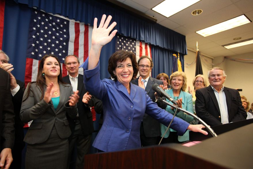 ** FILE ** Erie County Clerk Kathleen C. Hochul waves to the crowd at a union hall in Williamsville, N.Y., on Tuesday, May 24, 2011, after winning a special election in New York's 26th Congressional District. (Associated Press)