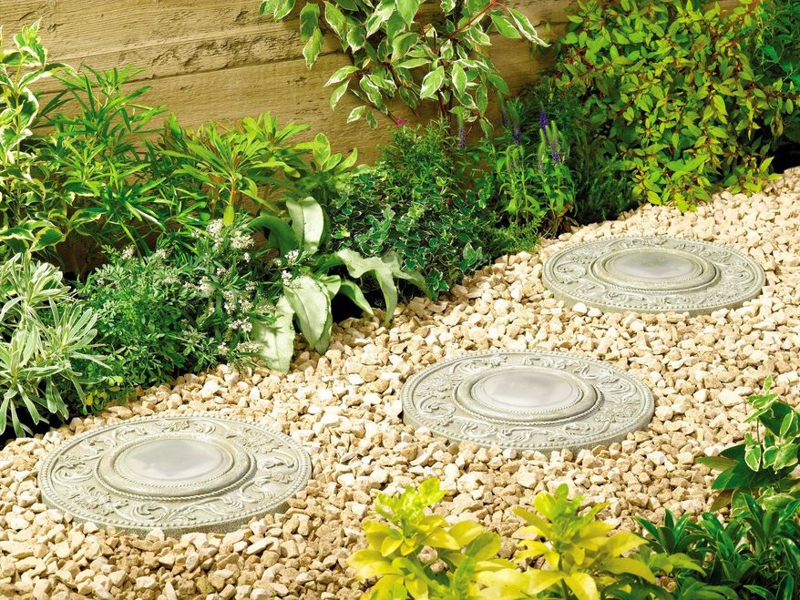 This product image courtesy of My Solar Shop shows solar stepping stones lighting a pathway. Whether on a small terrace or in a sweeping landscape, lighting creates a welcoming and often dramatic atmosphere. (AP Photo/My Solar Shop)
