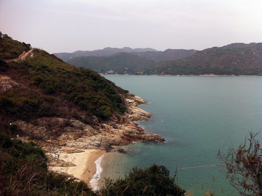 ASSOCIATED PRESS PHOTOGRAPHS
After arriving at Pui O Bay via ferry, visitors can take in the clear water and fine sand before setting off on designated hiking trails for further exploration of Lantau Island, which includes a large monastery, a fishing village and a cable car to the Big Buddha.