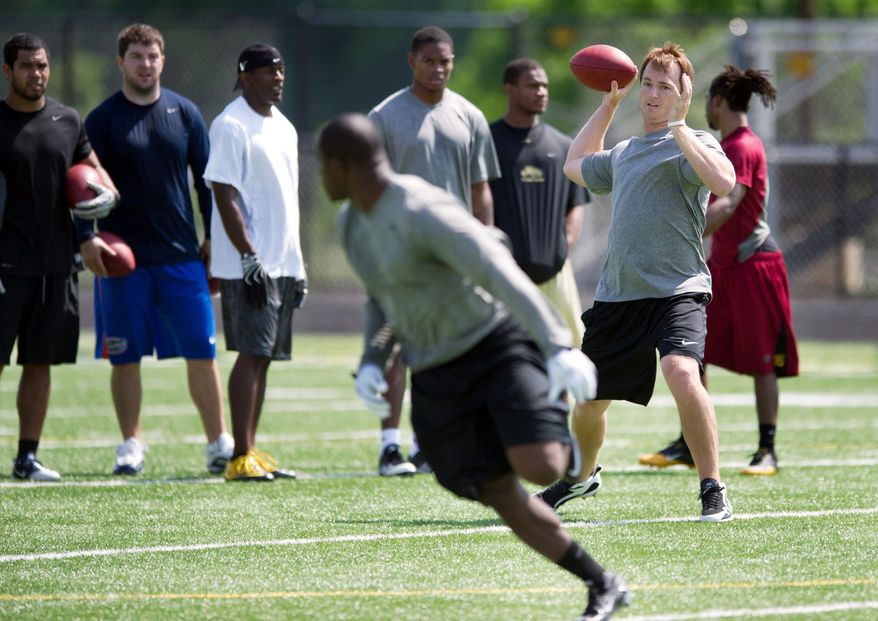 ROD LAMKEY JR./THE WASHINGTON TIMES
Quarterback John Beck rolled out for a pass Tuesday, one of three days the team practiced at a Northern Virginia high school.