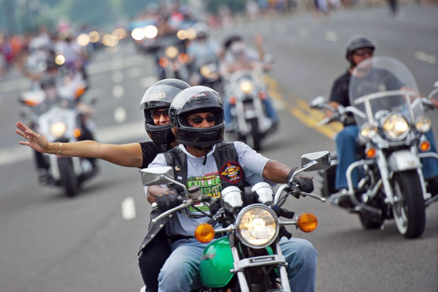 Bikers in the annual Rolling Thunder motorcycle rally ride across Memorial Bridge on Sunday. Secretary of State Robert M. Gates told the participants "your work and the sounds of the bikes" help remind soldiers of their "cost incurred and enduring strength." (Drew Angerer/The Washington Times)