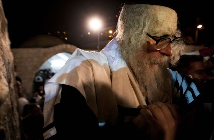 Rabbi Eliezer Berland leaves after praying at Joseph's Tomb in the West Bank city of Nablus early on Monday, May 30, 2011. (AP Photo/Sebastian Scheiner)