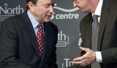 True North Sports and Entertainment chairman Mark Chipman, right, and NHL commissioner Gary Bettman shake hands after a news conference, Tuesday May 31, 2011, in Winnipeg, Manitoba, announcing that the Atlanta Thrashers are moving to Winnipeg. (AP Photo/The Canadian Press, David Lipnowski)