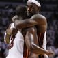 NBA Finals: Miami Heat&#x27;s LeBron James hugs Dwyane Wade during the second half of Game 1 of the NBA Finals basketball game against the Dallas Mavericks, Tuesday, May 31, 2011, in Miami. The Heat defeated the Mavericks 92-84. (AP Photo/Lynne Sladky)