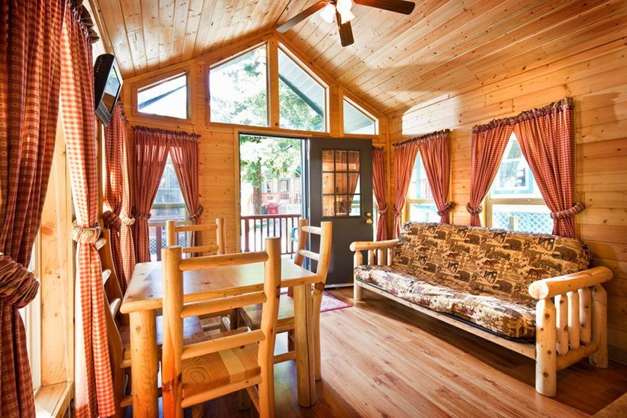 PHOTOGRAPH PROVIDED BY KAMPGROUNDS OF AMERICA INC.
A KOA Lodge in Petaluma, Calif., with a bathroom, indoor shower, comfortable beds and kitchenette with microwave, is perfect for a group getaway. A park model unit in El Capitan Canyon, a campground resort near Santa Barbara, Calif., is at right. Camping still can mean tenting, or it can mean comfortable lodging and a full roster of activities.
