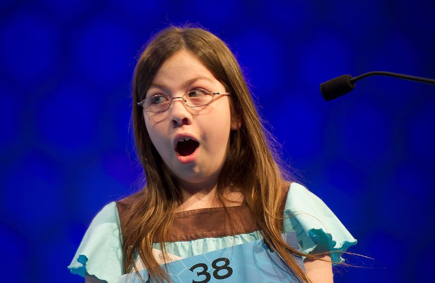 Grace Remmer, 12, of St. Augustine, Fla., looks surprised after correctly spelling "Liptauer" during Round Six of the semifinals round of the 2011 Scripps National Spelling Bee on Thursday, June 2, 2011 at the Gaylord National in Oxon Hill, Md. Forty-one spellers competed in the semifinals, and only 13 will advance to the finals, which will be broadcast live this evening on ESPN. Grace missed "casquetel" in Round Seven, so she did not advance. (Barbara L. Salisbury/The Washington Times)