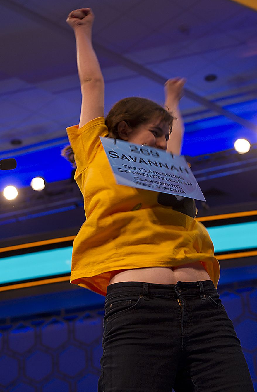 Savannah Aldridge, 13, of Clarksburg, W.Va., throws up her arms after correctly spelling "soliloquy" during Round Two of the 2011 Scripps Howard National Spelling Bee on Wednesday, June 1, 2011. Two hundred and seventy-five spellers from around the country competed in rounds two and three of the bee Wednesday at the Gaylord National in Oxon Hill, Md. Spellers were not eliminated during Wednesday's rounds, but rather earned points towards competing in the semifinals, which will be held Thursday. (Barbara L. Salisbury/The Washington Times)