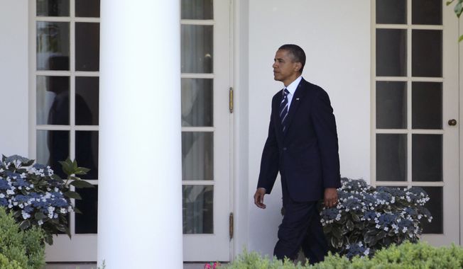President Barack Obama walks to the Oval Office of the White House in Washington, Friday, June 3, 2011, as he returned from Ohio. (AP Photo/Carolyn Kaster)
