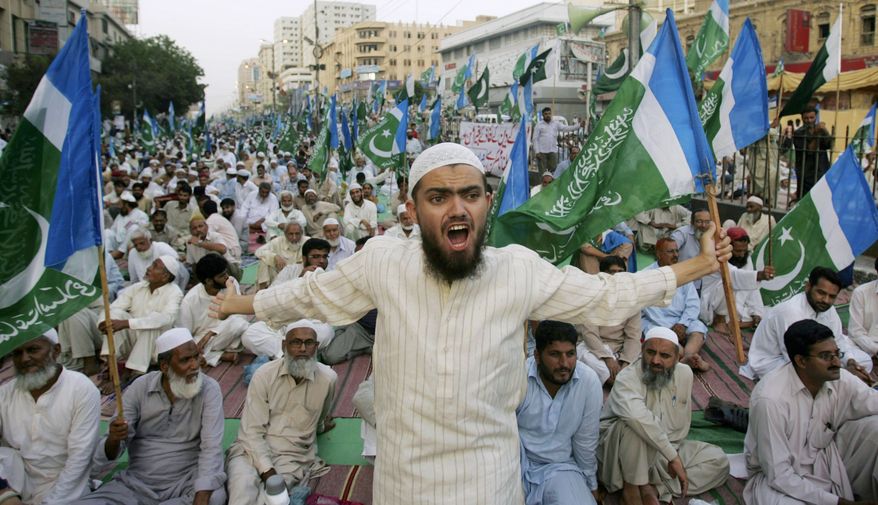 A supporter of the Pakistani religious party Jamaat-e-Islami shouts during a rally against drone attacks Saturday, June 4, 2011, in Karachi, Pakistan. Ilyas Kashmiri, a top al Qaeda commander and possible replacement for Osama bin Laden who is accused of the 2008 Mumbai massacre, was killed in an American drone-fired missile strike close to the Afghan border, a fax from the militant group he heads and a Pakistani intelligence official said Saturday. (AP Photo/Fareed Khan)