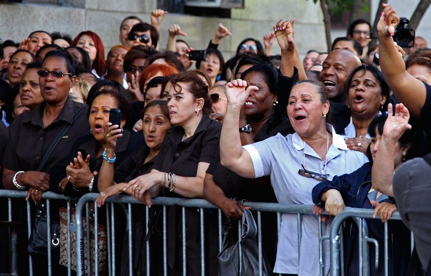 New York hotel workers jeer Dominique Strauss-Kahn as he arrives at the courthouse. "New York is the wrong place to mess with a hotel worker," said Aissata Bocum, a Ramada Inn housekeeper. (Associated Press)