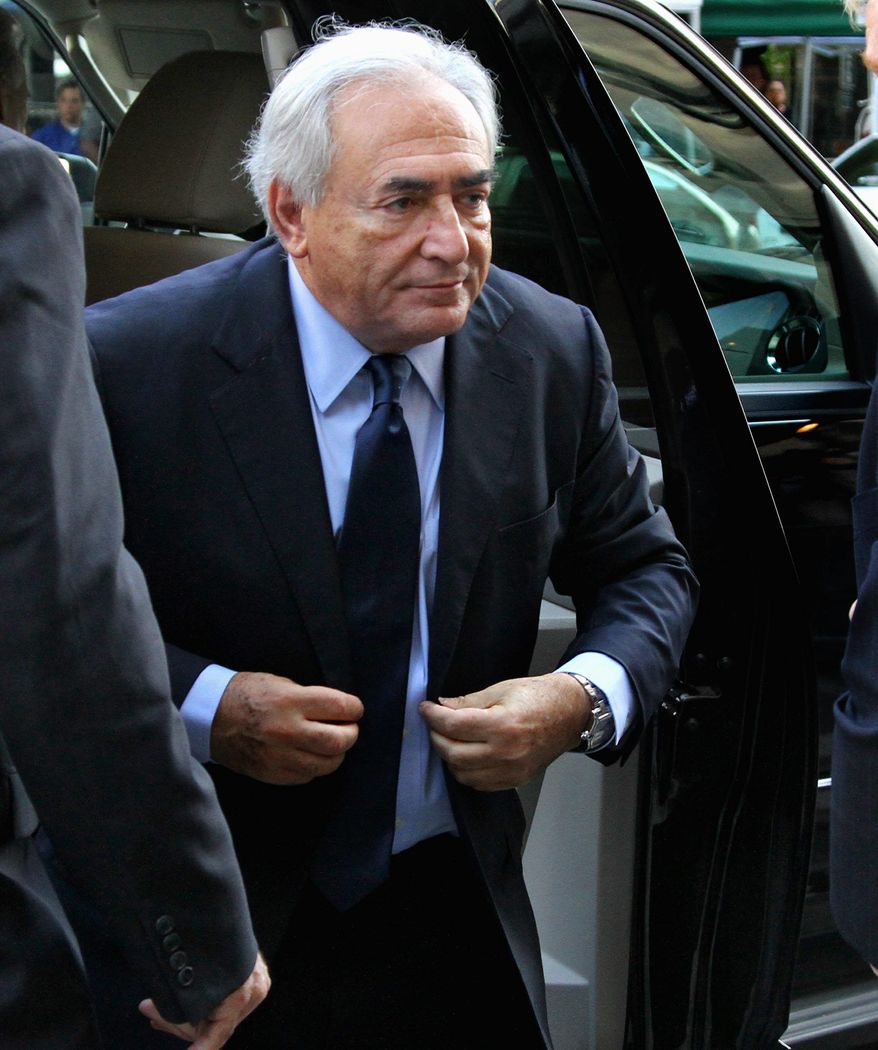 Former International Monetary Fund leader Dominique Strauss-Kahn arrives at the Manhattan Criminal Courts building on Monday for his arraignment proceedings on charges of sexually assaulting a Manhattan hotel maid. The French economist and diplomat has said he is not guilty. (Associated Press)