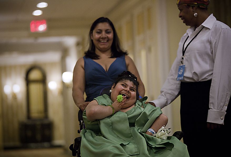 A student shares a laugh with her mother and a staff member at the Cinderella Ball at The Willard Intercontinental Hotel in Washington, D.C. on Sunday, June 5, 2011. This was the sixth annual Cinderella Ball, where students with life-threatening illnesses or disabilities came together to celebrate. (Pratik Shah/The Washington Times)