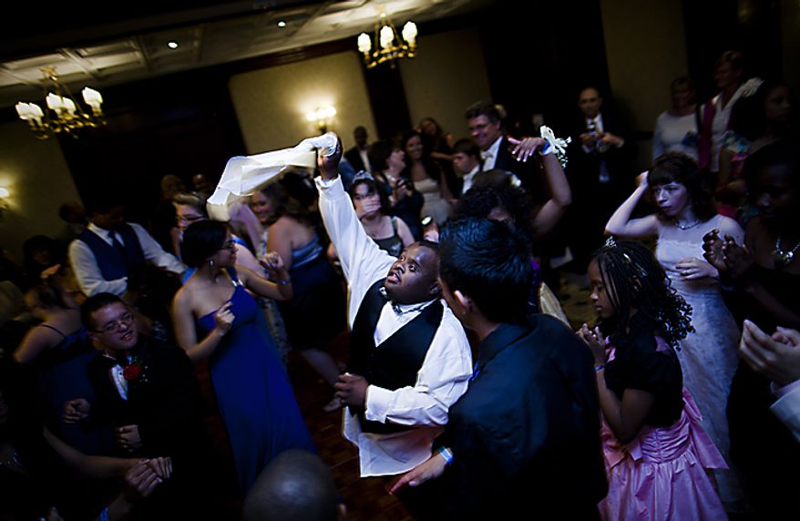 Students at the Cinderella Ball let loose on the dance floor with friends and family at The Willard Intercontinental Hotel in Washington, D.C. on Sunday, June 5, 2011. This was the sixth annual Cinderella Ball, where students with life-threatening illnesses or disabilities came together to celebrate. (Pratik Shah/The Washington Times)