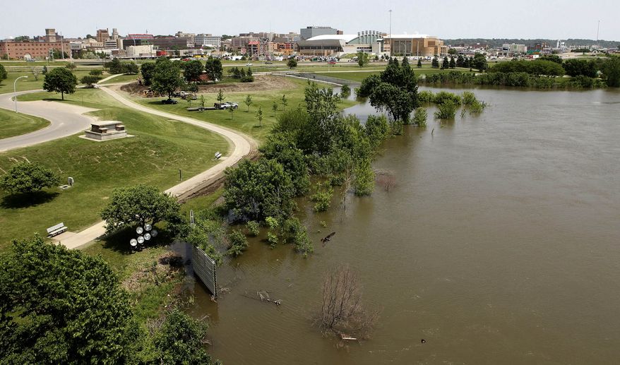 The water level of the Missouri River continues to rise in Sioux City, Iowa, on Sunday, June 5, 2011. Cities and towns up and down the Missouri River in Nebraska and Iowa are inspecting flood walls and piling up sandbags to prepare for a deluge of water the U.S. Army Corps of Engineers will release later this month. (Jim Lee/Sioux City Journal)