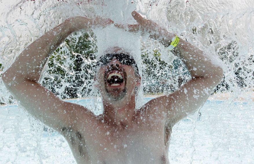 Randy Lovesky cools off in the water park on a hot sunny day at Darien Lake Theme Park Resort in Darien Center, N.Y., on Wednesday. Temperatures around 90 and higher were recorded across much of the South, the East and the Midwest. (Associated Press)